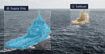 Two ships identified by a machine learning model, one of them incorrectly labeled as a sailboat.