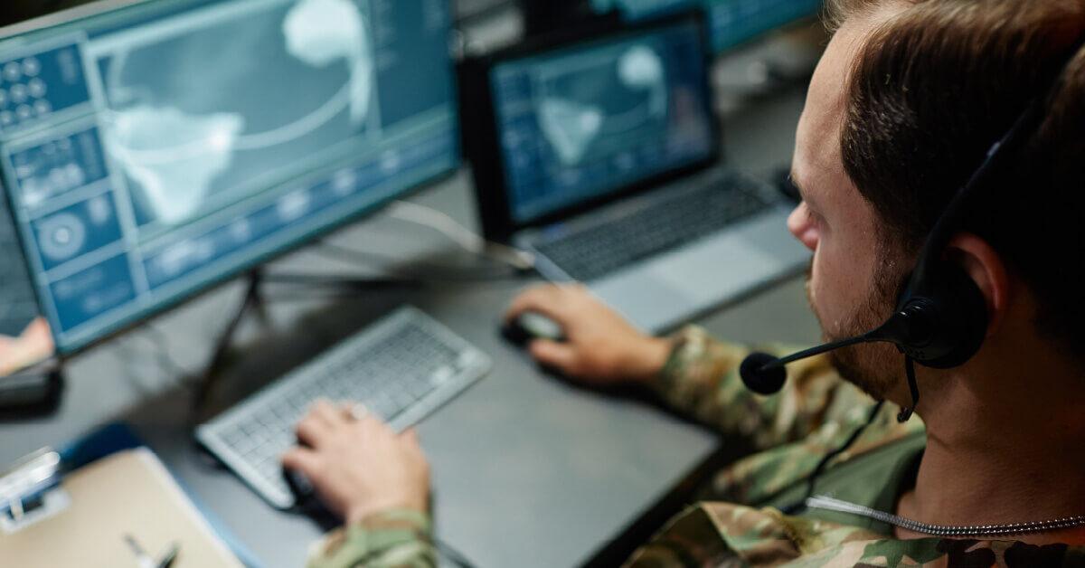 A defense analyst working on the computer